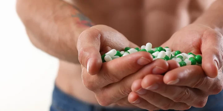 Holding a handful of pills