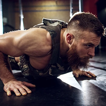 Bearded man doing military push ups