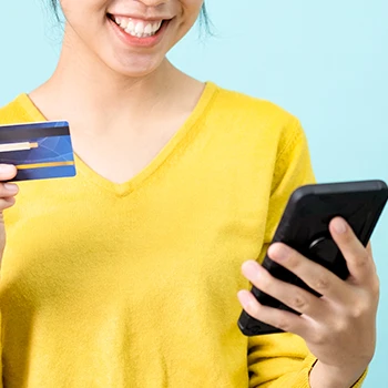 Holding a phone and a credit card