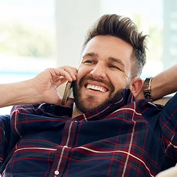 Bearded person talking to phone