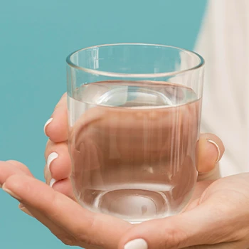 Holding a glass of water