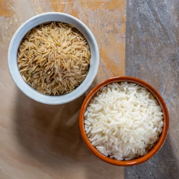 Brown Rice and White Rice on two separate bowl