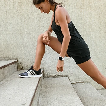 A woman stretching on a stair