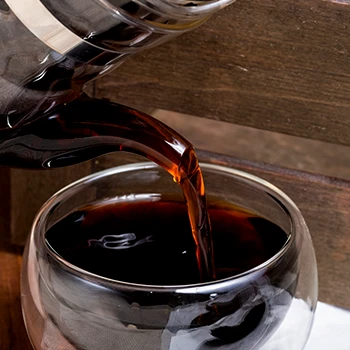 Pouring a Pu Erh Tea on glass cup