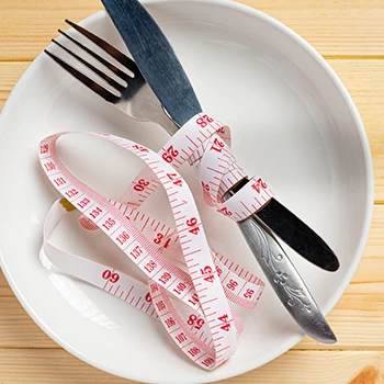 Measuring tape around utensils