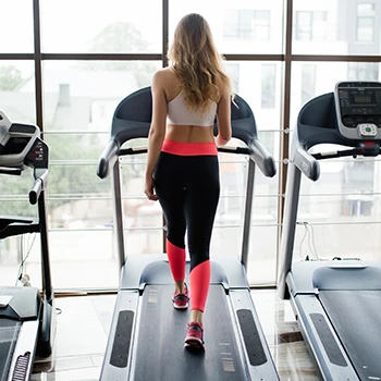 A woman doing treadmill exercise
