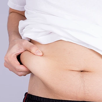 A man pinching his side belly fat