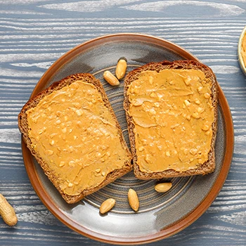 Peanut butter spread on a toast