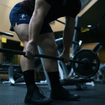 A person doing a romanian deadlift