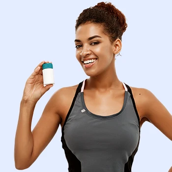 A woman holding supplement container
