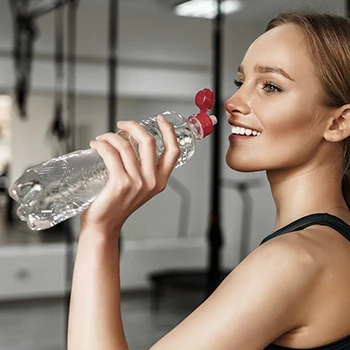 Drinking a mineral water in a bottle