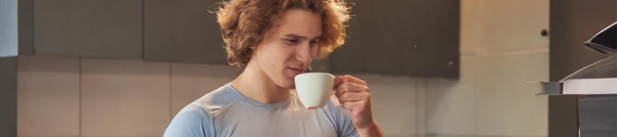 man drinking a cup of tea