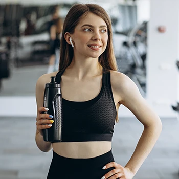 An athlete holding a black tumbler