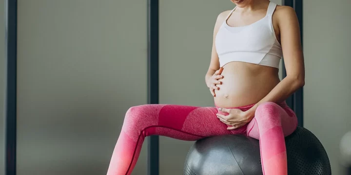 Pregnant woman sitting on a ball