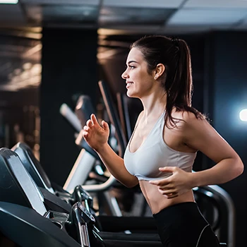 Woman doing cardio exercises on a treadmill