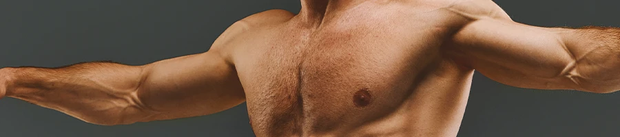 A shot of a muscular man's chest