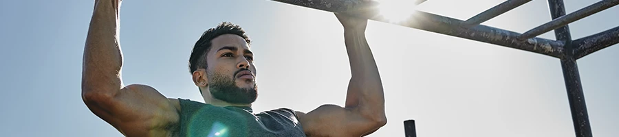 Doing pull ups outdoors