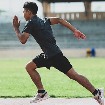 A person running fast outdoors