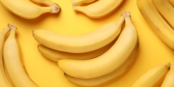 Bananas in plain yellow background