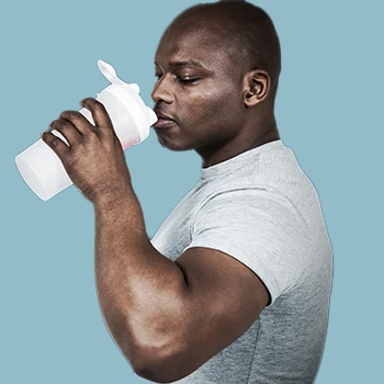 A man drinking from his tumbler