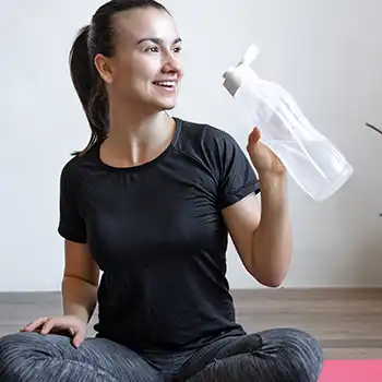 Drinking water while on a yoga pad