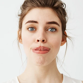 A woman stretching her tongue to nose