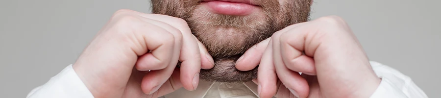 A bearded guy showing his double chin