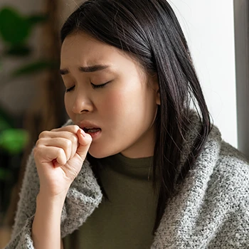 A woman with low immunity and coughing