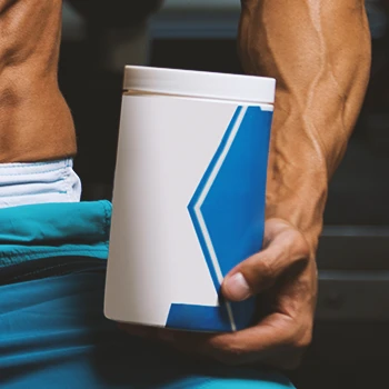 Close up shot of a person holding pre-workout