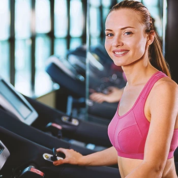 A woman in the gym doing cardio