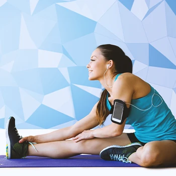 A woman stretching on a yoga mat