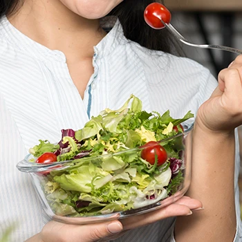 Eating a bowl of salad