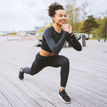 A woman stretching outside