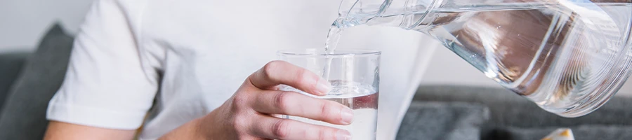 Pouring water on glass