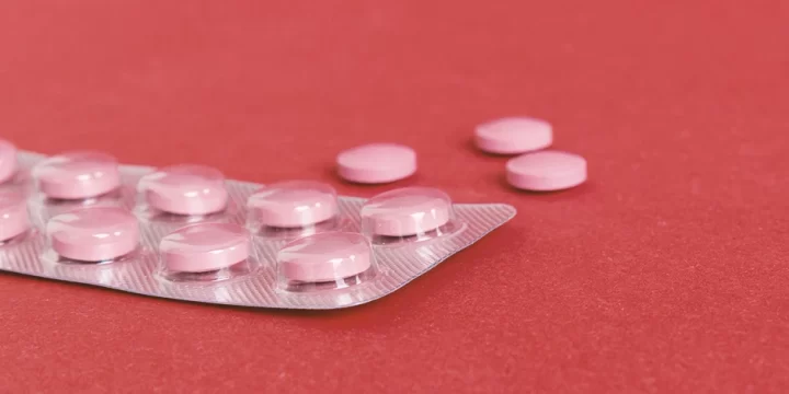 Pink tablets on a table