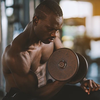 A man in the gym lifting weights