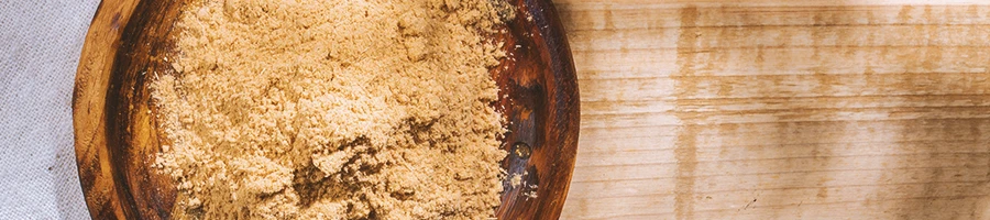 Top view of a wooden bowl with Maca