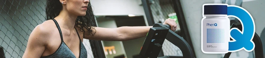 A woman working out on gym equipment with PhenQ in the foreground