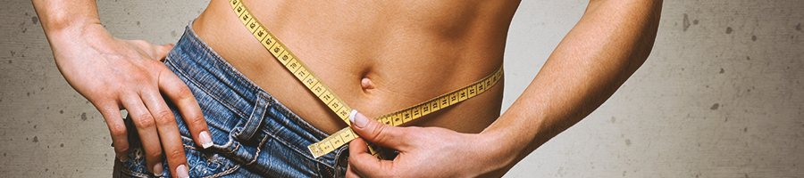 A person measuring her waist