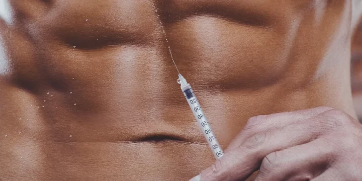 A buff male holding a steroid injection