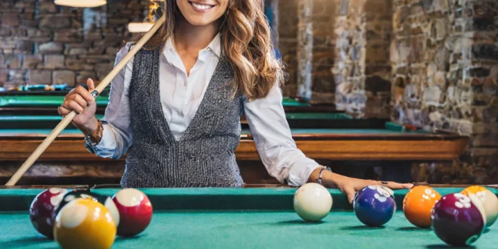 A hot female player playing pool