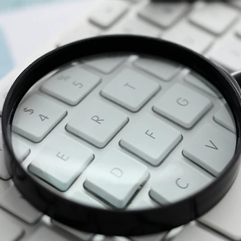 Magnifying glass on a keyboard