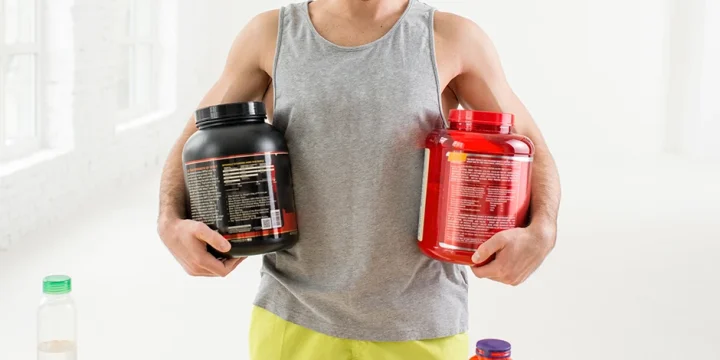 Holding two different pre-workout supplements