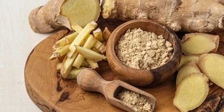 Assorted types of ginger in wooden board