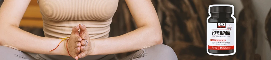 A person doing yoga with Forebrain Force Factor on the side