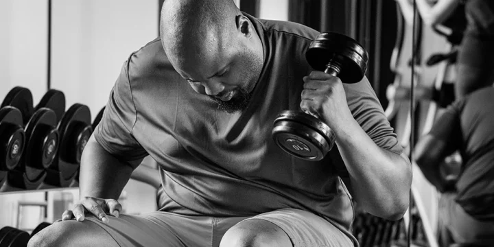 A man lifting weights in gym