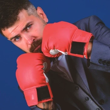 A man wearing gloves that experiences increased testosterone production