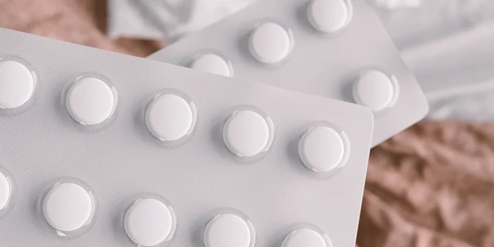 A stack of white tablets on a table
