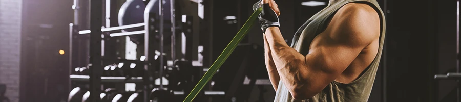 A man doing pull exercises in the gym