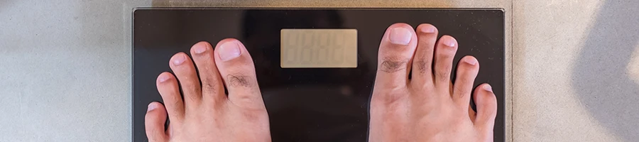Using a weighing scale to measure weight